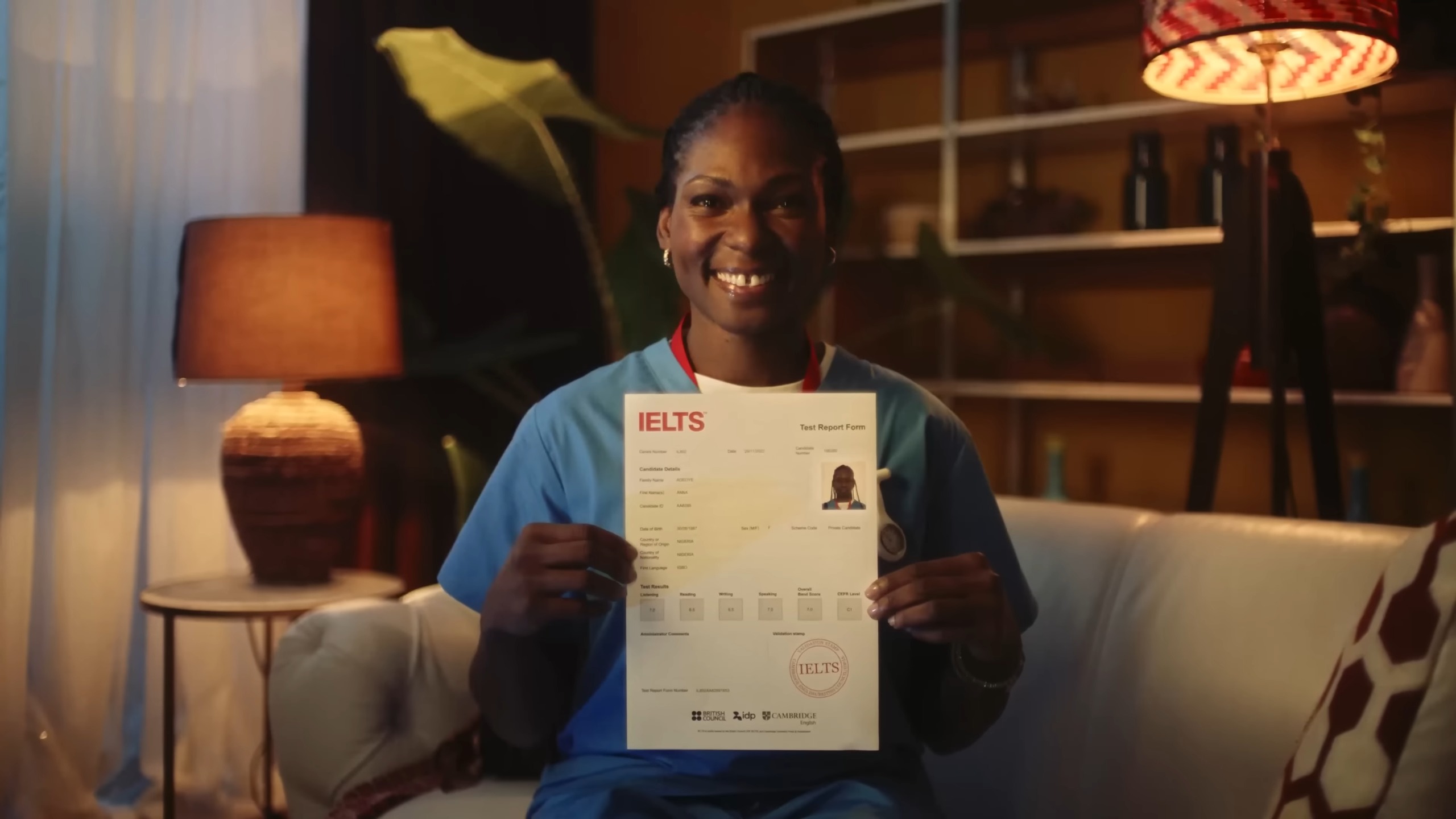 A woman working in the healthcare sector holds an IELTS certificate